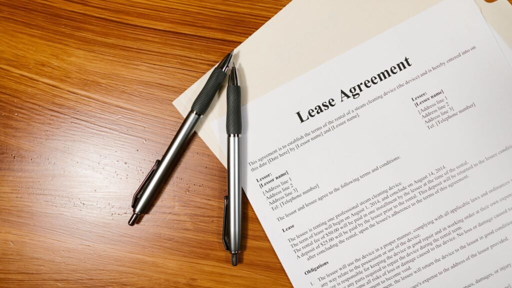Lease agreement and pens on a desk, representing the security deposit terms in a rental agreement